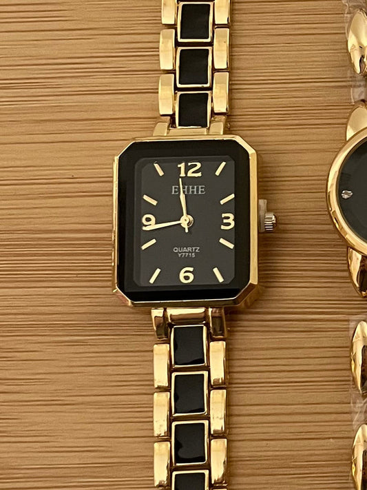 Rectangle shaped black blocks golden watch