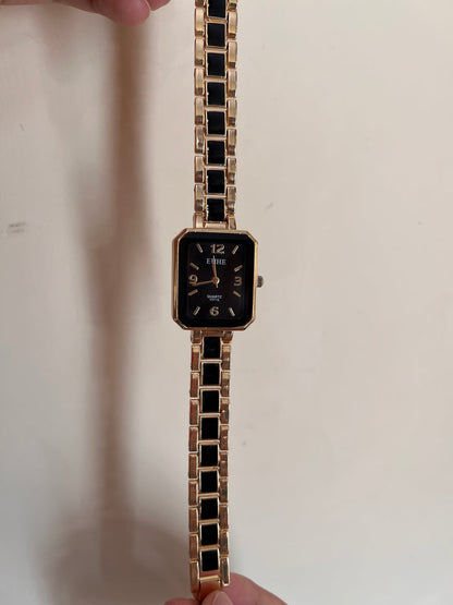 Rectangle shaped black blocks golden watch