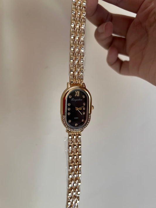 Oval black dial watch
